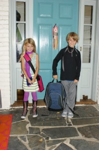 Yep, these are the kids on their first day of school.  I have one incredible artist and a one super smart jock.  Notice the paper fish sail adorning our door!